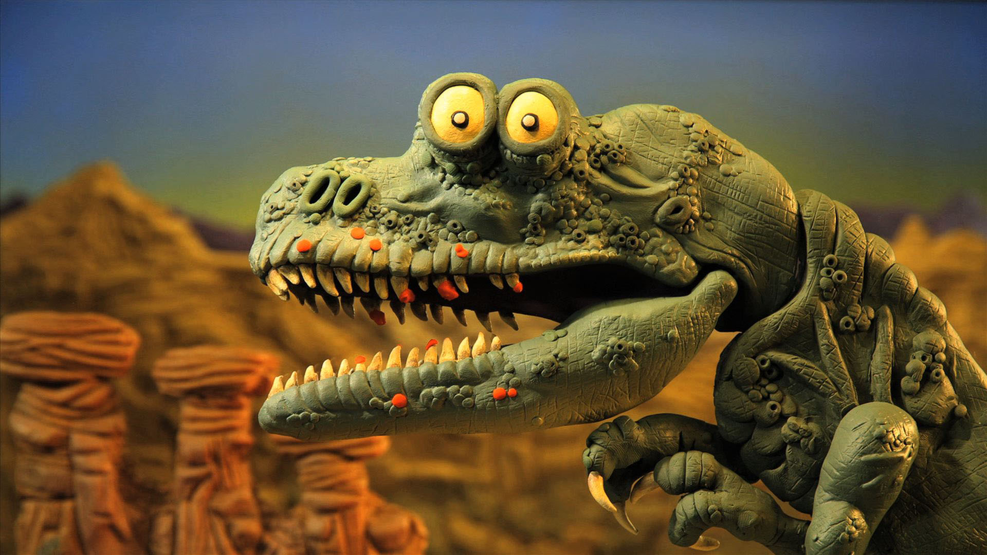 A claymation dinosaur with bared teeth, part of an animated recreation segment, set against a desert backdrop.